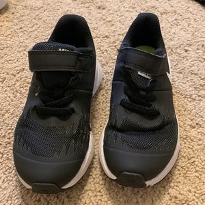 Boys Nike sneakers size 10.5c. Velcro. Black and white.